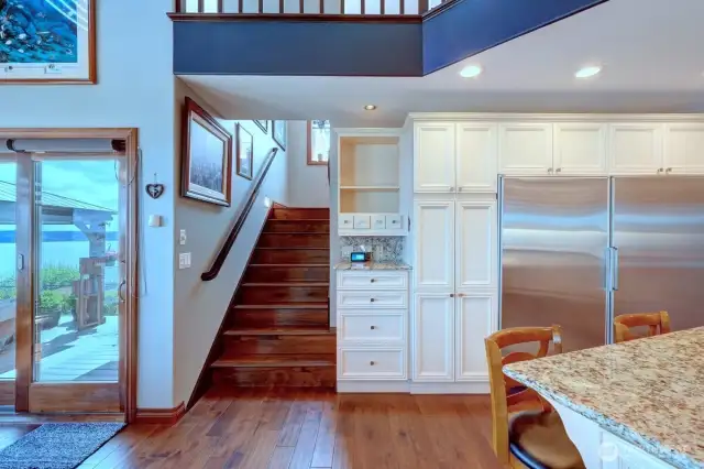 Stairway off kitchen to second level.