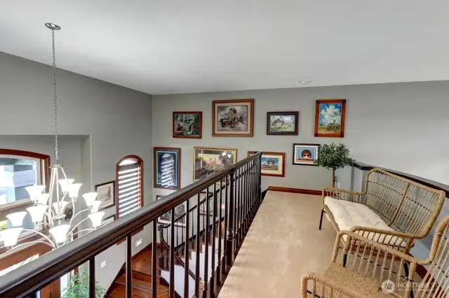 The upstairs loft connects the two sets of stairs at either end of the house.