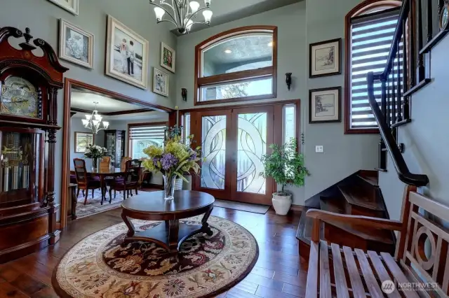 Spacious foyer creates a beautiful entrance with stairway to upper level off to the left.