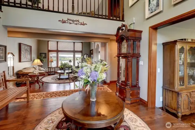 Spacious foyer looking opens up to formal living room overlooking Mt. Rainier, Puget Sound and Chambers Bay Golf Course.