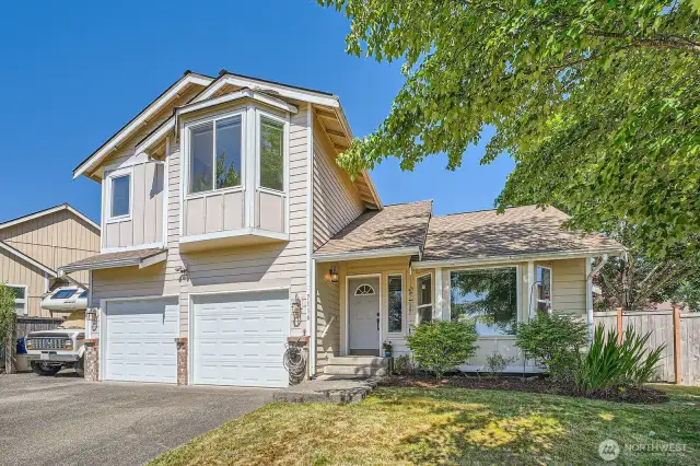 Picture-Perfect Curb Appeal  Lush, mature landscaping and thoughtfully manicured grounds frame the home beautifully, offering a serene and welcoming first impression. The pride of ownership shines through every detail.