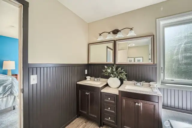 Dual-Sink Vanity with Extra Storage  The primary bathroom boasts a spacious dual-sink vanity, providing ample counter space and additional storage to keep your essentials organized and easily accessible.