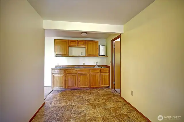 Downstairs bar and eating area bedroom through the door to the left.  picture is taken from the back door access to the back yard.
