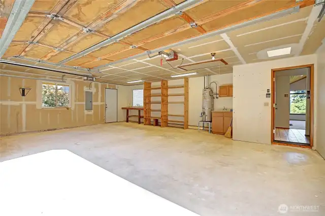 Spacious garage 2 car garage with attic ladder for additional storage