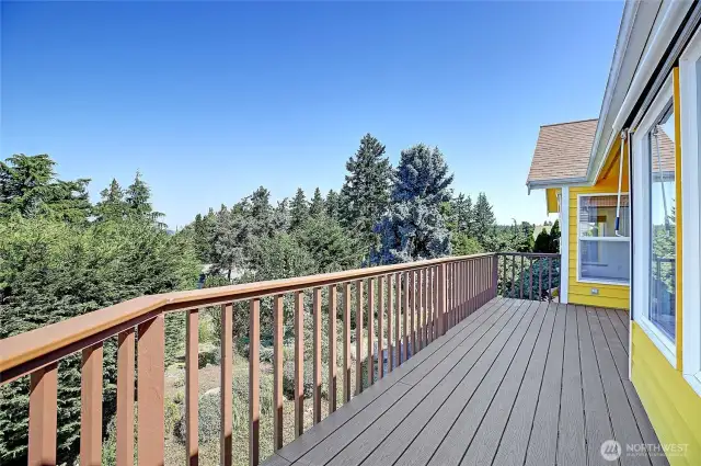 wrap around deck off of kitchen. notice the blinds on all the sound facing windows.