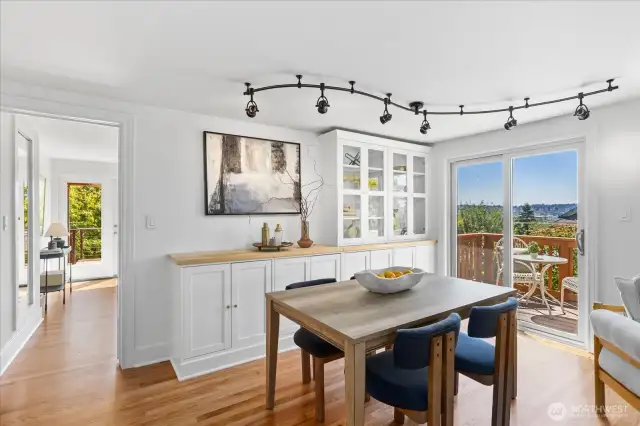 Track lighting, storage, sliding doors in the multifunctional space.