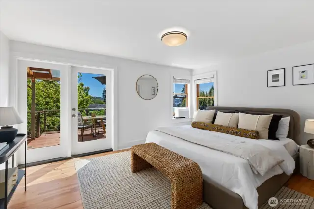 Primary Bedroom with new French Doors that access the back deck and allow more Southern light in.