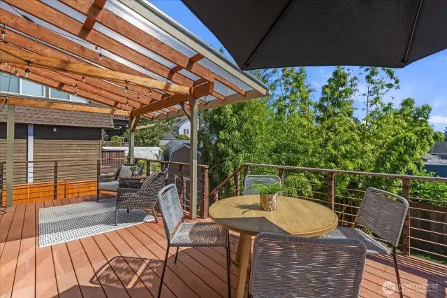 Spacious deck to entertain all year long with access to the backyard, shed and hot tub!