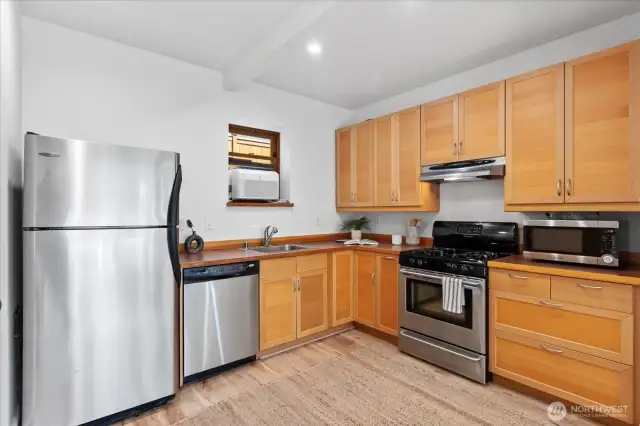 Lower level full kitchen with tons of storage.