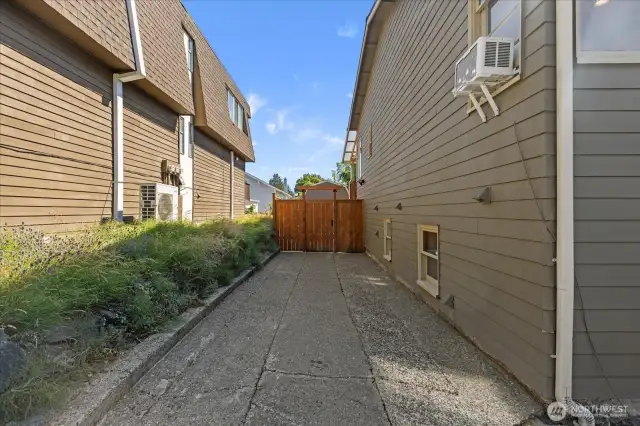 Plenty of space to park multiple cars on the side of the home.