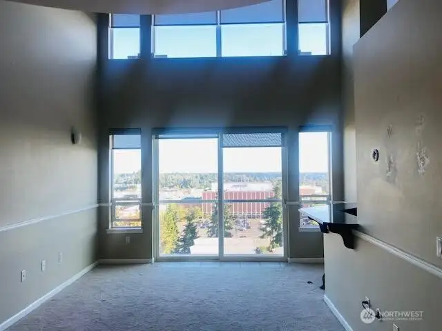 living room with floor to ceiling windows