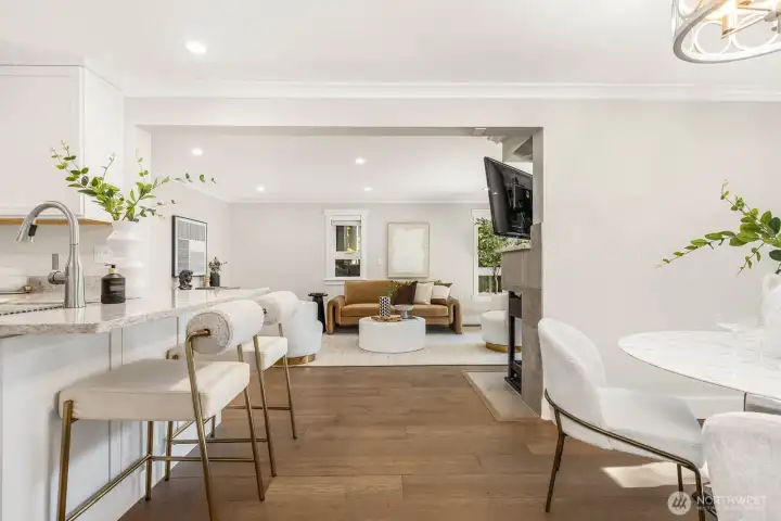 The open layout seamlessly connects kitchen, dining, and living areas for effortless entertaining.
