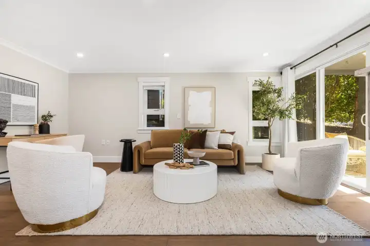 Spacious living room with updated flooring and fresh finishes, designed for relaxation and gatherings.