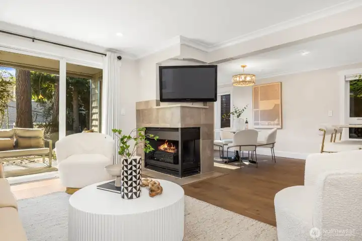The ideal balance of indoor comfort and outdoor access, complete with a cozy fireplace and sliding doors to the patio.