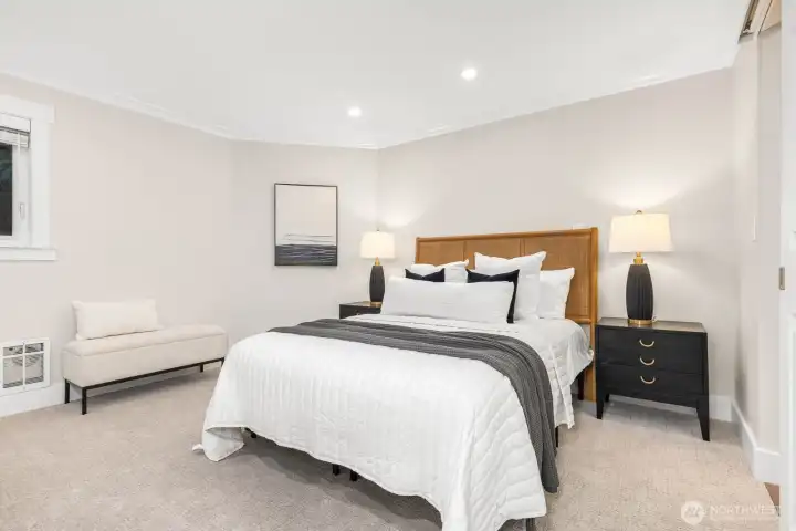 Both bedrooms feature brand-new carpet for a fresh, move-in ready feel. Each room offers generous space, neutral tones, and modern lighting to create cozy retreats.