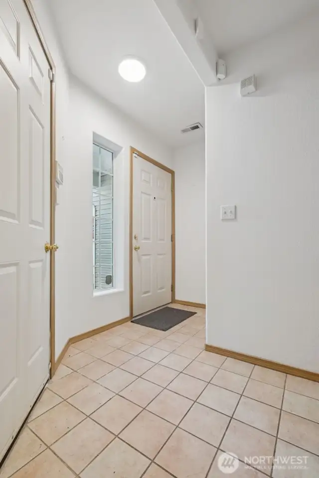 The formal entry is adjacent the spacious 1 car garage.