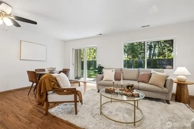 The living area opens to the dining area and kitchen.