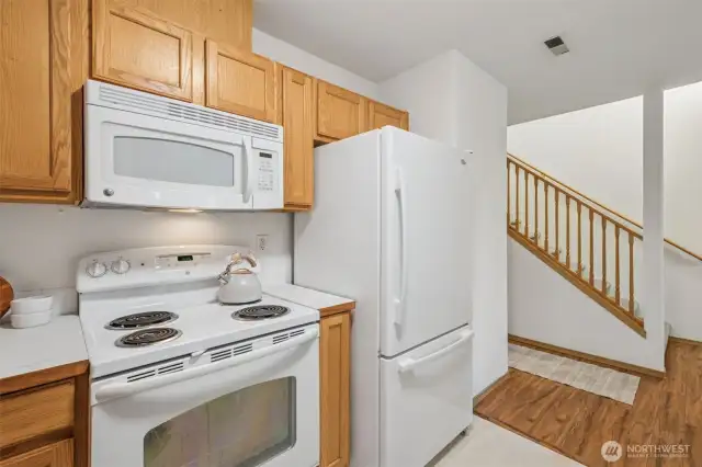 This crisp white kitchen awaits your dining creations!