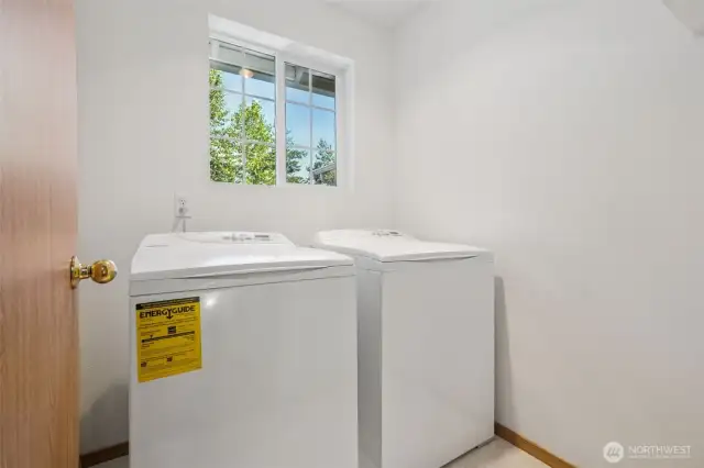 The laundry room is conveniently located on the upper level.
