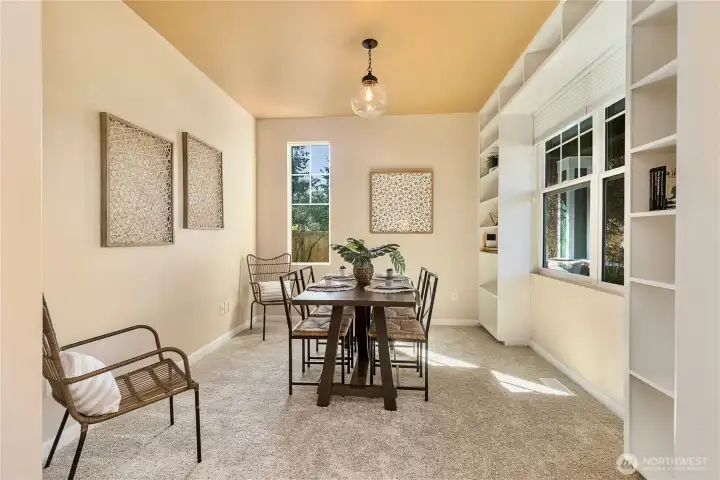 Dining room features built-in shelving for display or serving storage. This would serve as an excellent office, as well!