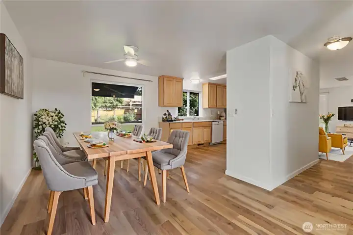 Open Dining area virtually staged with a beautiful view of private backyard.