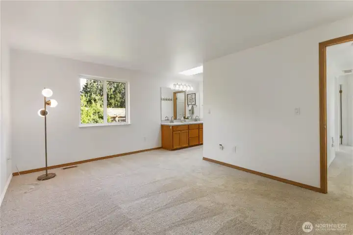 Primary bedroom with new carpet.