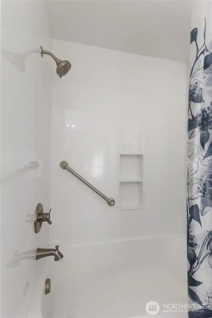 Main bath with new bathtub and surround.