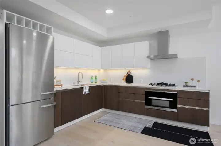High-End Modern Kitchen with Miele Appliances, Custom Wine Built-In and Ample Countertop Space.