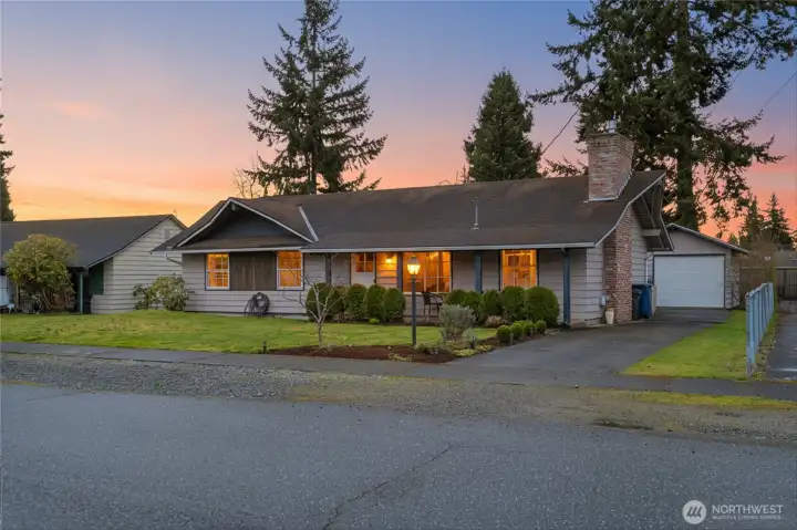 Beautiful twilight exterior captures the home’s inviting curb appeal and warm evening glow.