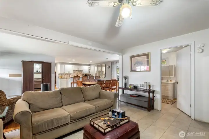 Living Room - Spacious living area with open flow to the dining room and kitchen, creating a comfortable layout for daily living.