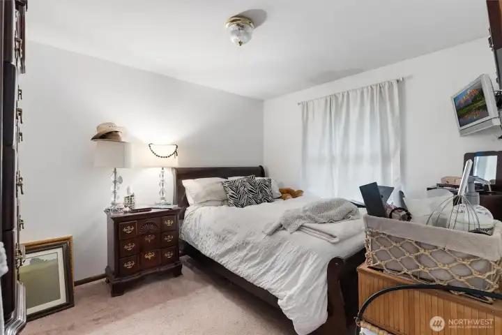 Primary Bedroom -   Comfortable primary bedroom with natural light and a functional layout for everyday living.