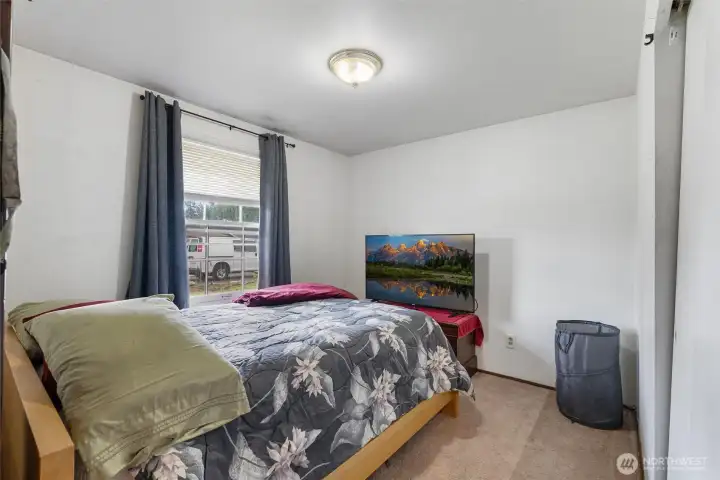 Secondary Bedroom - Bright secondary bedroom with soft natural light and comfortable layout.