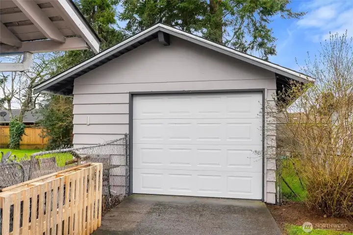 Detached one-car garage offers added parking, storage, workspace potential, or room for hobbies.