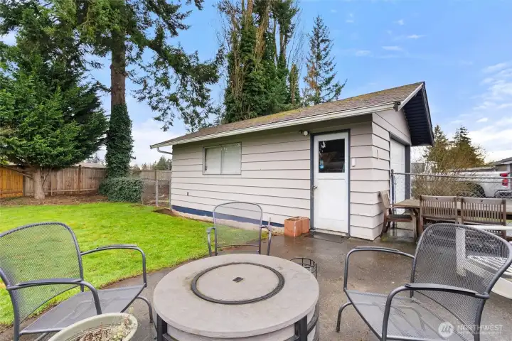 Detached garage with side entry access offers storage, parking, and extra usable space.