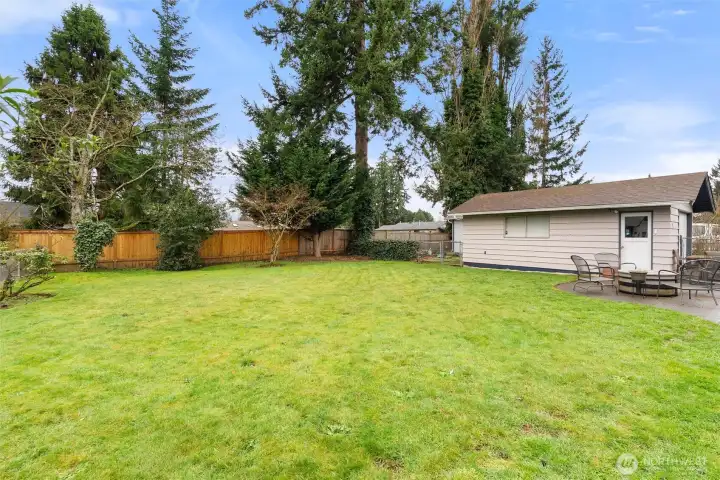 Expansive backyard offers plenty of room to garden, play, entertain, or simply enjoy the outdoors.