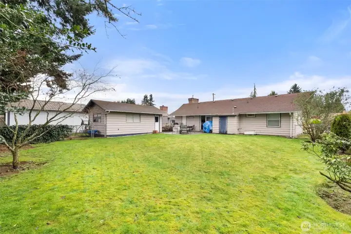 Oversized backyard provides a wonderful setting for gatherings, pets, recreation, or future personalization.