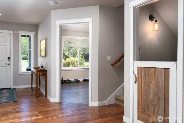 half door under stairway leads to possible play or pet area