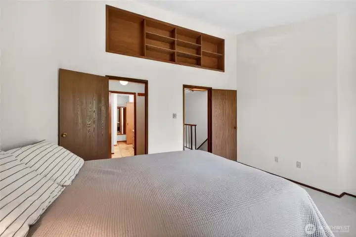 Primary Bedroom    Spacious primary suite offering privacy, comfort, and generous closet space. Large windows create a light-filled retreat with room for a king-sized bed, additional seating, or home office setup. Ideal for buyers seeking a relaxing primary bedroom with functional storage and flexible living options.
