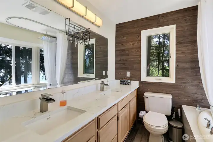 The primary bath. More maple colored cabinets, granite counters, updated fixtures and flooring The primary bath. More maple colored cabinets, granite counters, updated fixtures and flooring