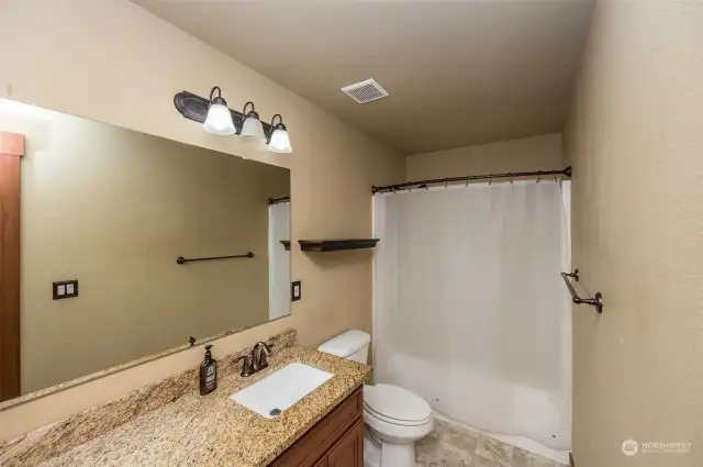 Full bathroom on upper level has 2 sinks