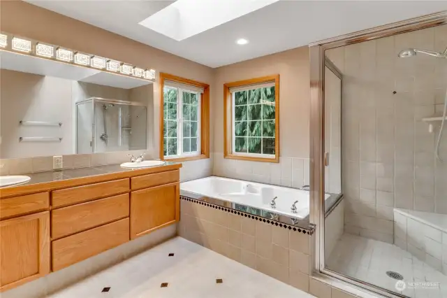 Lovely primary bath with jetted soaking tub.