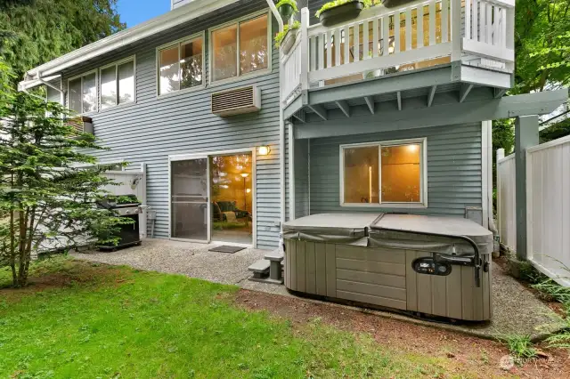 Private backyard with hot tub. Hot tub has been regularly serviced and conveys with the home.