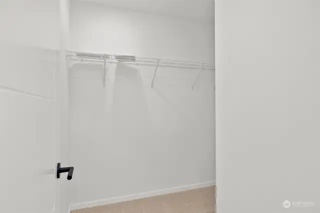 Nice walk-in closet in the primary! Model home. Colors and finishes may vary.