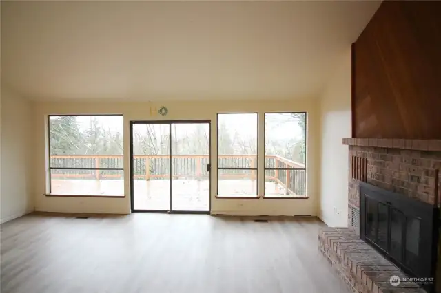 Windows in the living room looking at the viewe and deck