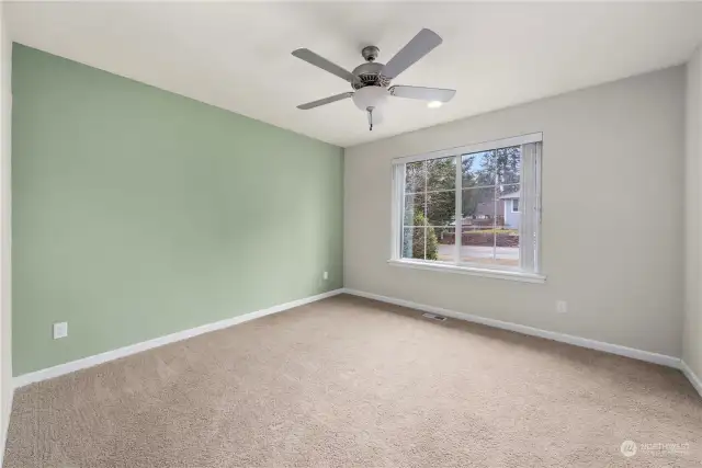 Large, bright primary bedroom.