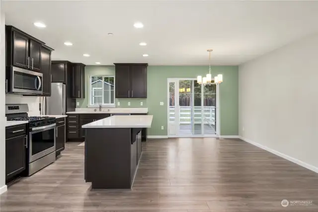 Gorgeous kitchen with stainless appliances.  Laundry room is to the left of the kitchen.