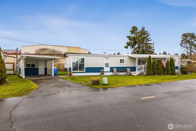 Nice size carport w/ storage shed.