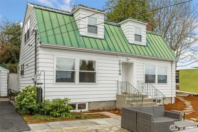 Classic 1941 architecture with a standing seam metal roof, double paned/insulated windows and thoughtful updates throughout.