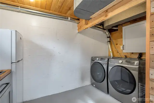 Lower level full sized washer and dryer.
