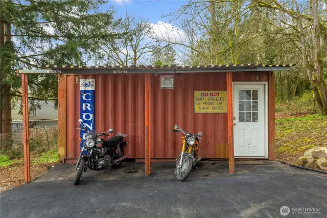 Converted shipping container provides a secure detached workshop and/or storage space.